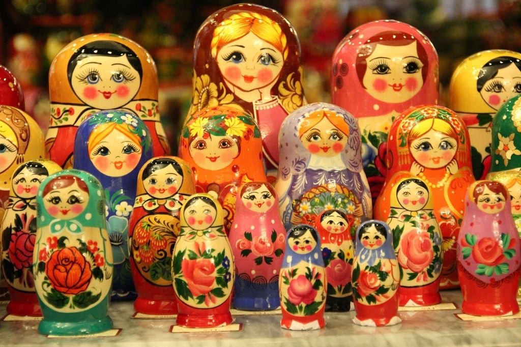 A row of colorful russian matryoshka dolls