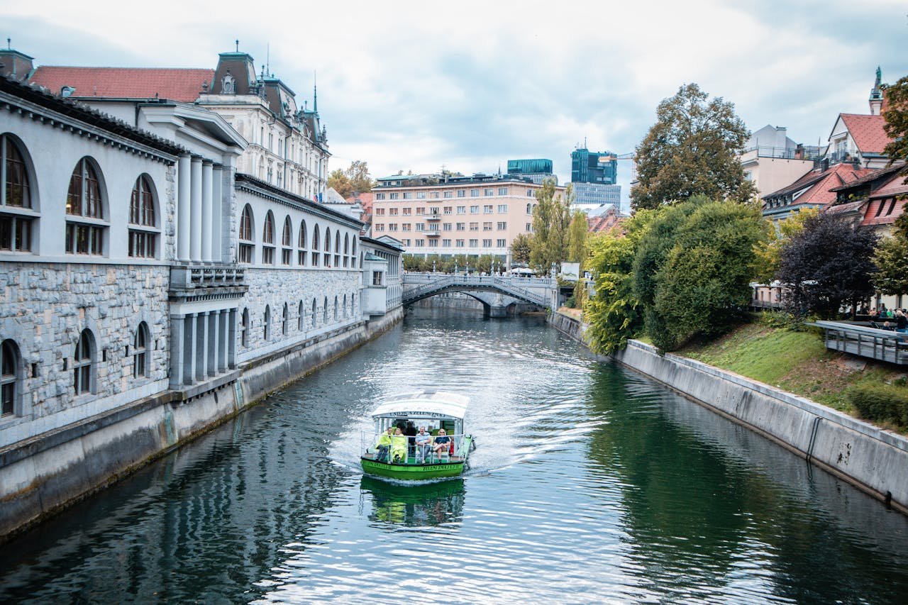 Tourists on Sailboat Cruising Sava River in Slovenia