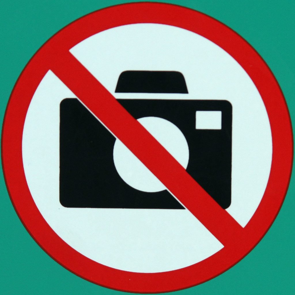 No Photography sign for traveler in Santorini Greece
