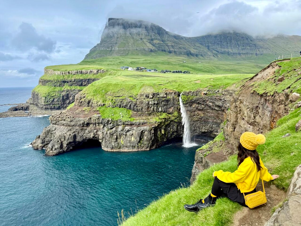 Scenic View of Múlafossur Waterfall in Faroe Islands