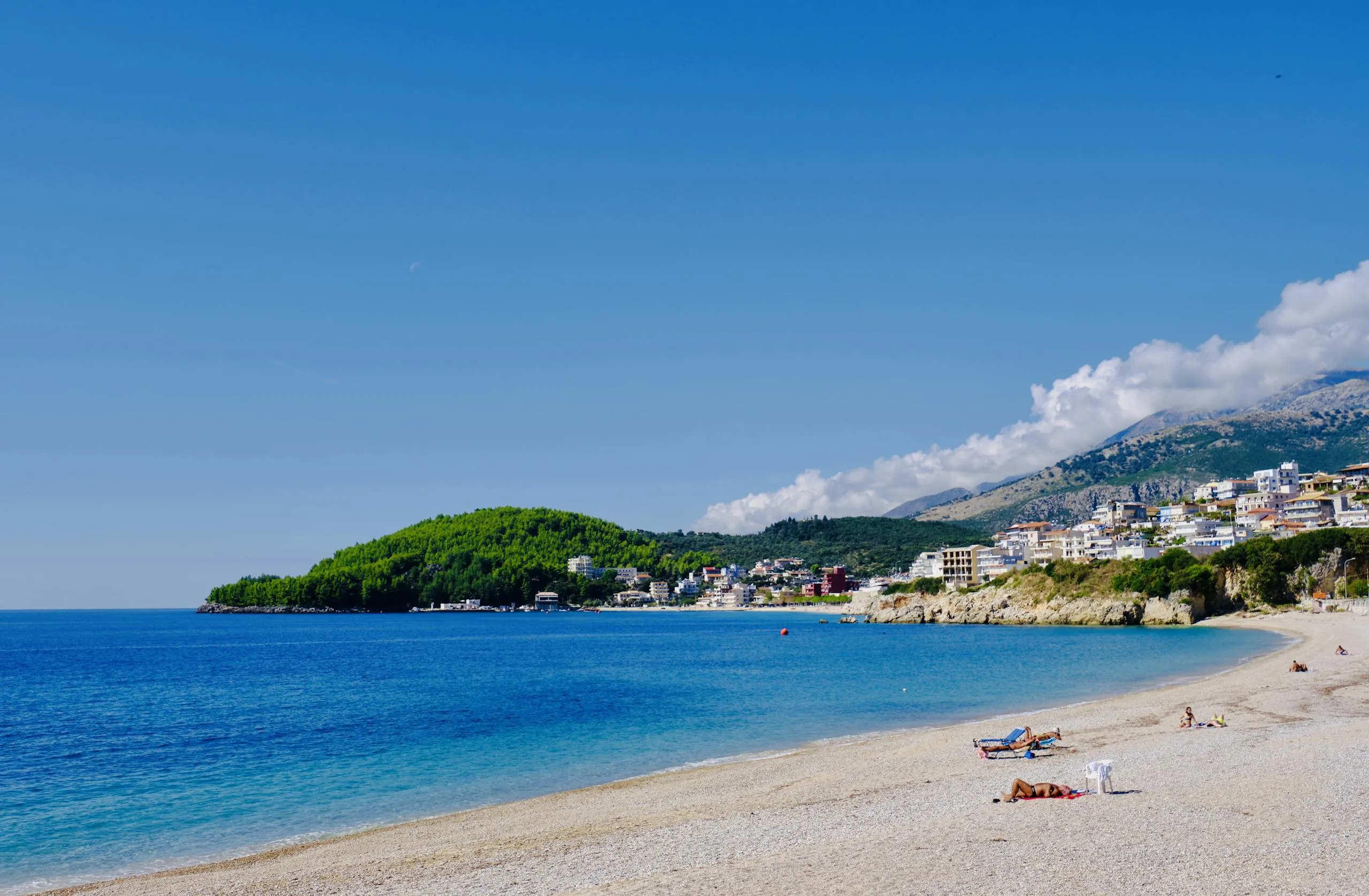 Beautiful Himarë beach in Albania with stunning blue waters and coastal landscape.