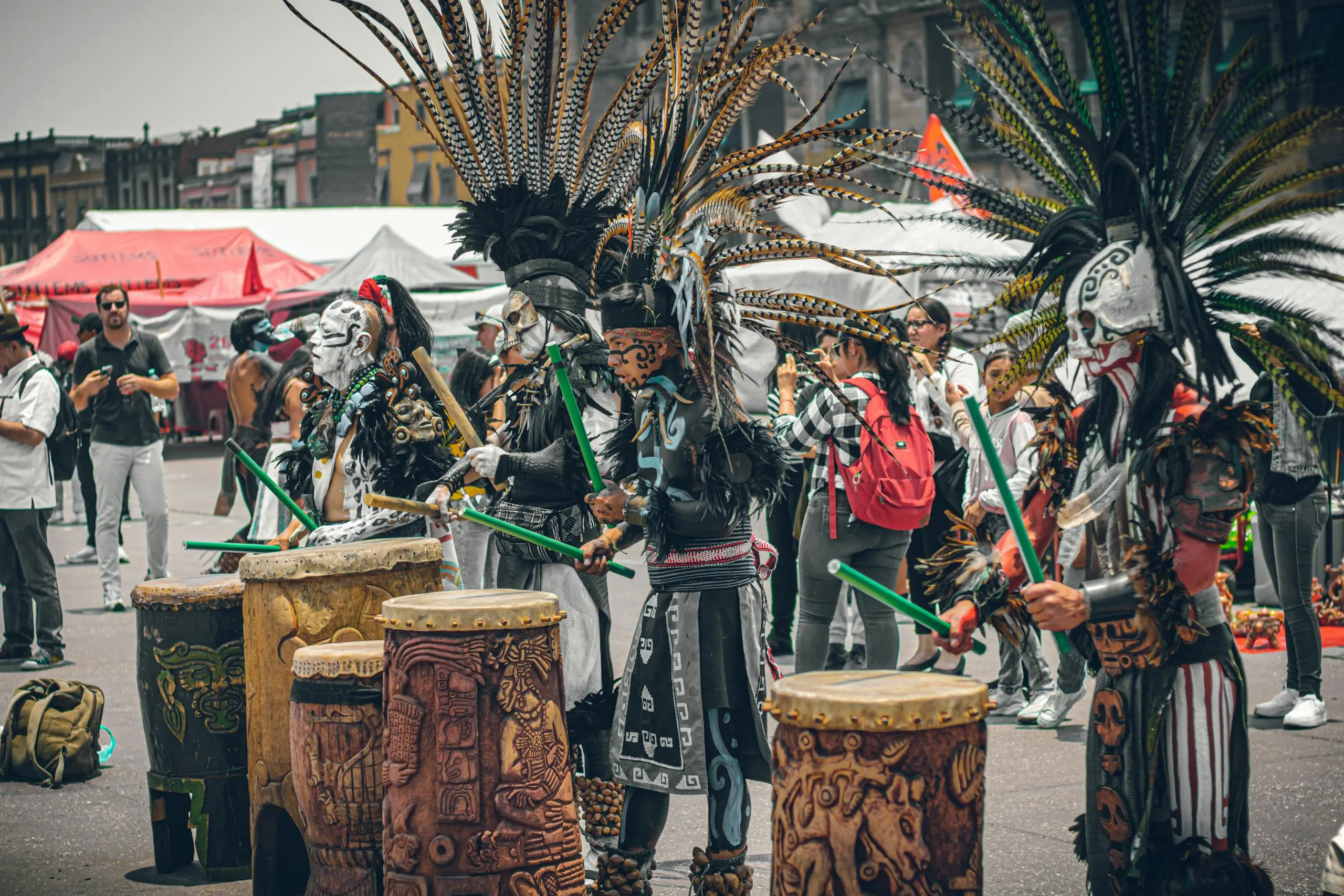 Traditional dancers in elaborate costumes perform in Mexico City, showcasing vibrant cultural heritage.