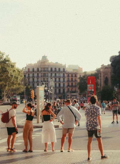 Busy urban street scene capturing the lively atmosphere in downtown Barcelona with people strolling.