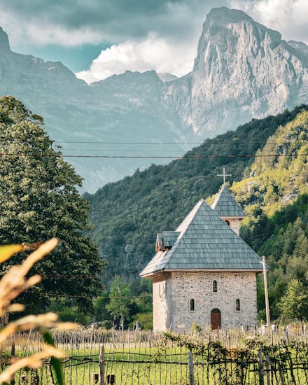 Discover a quaint chapel nestled in the picturesque Theth Valley, surrounded by majestic Albanian mountains.